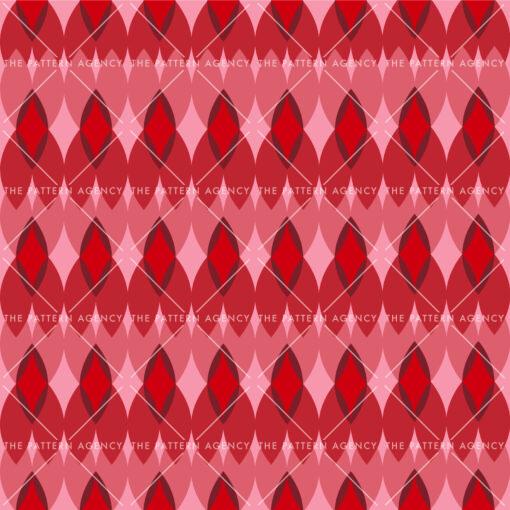 A seamless pattern of geometric shapes in shades of red and pink adorns a red background. The pattern consists of interconnected rhombuses and triangles that create a dynamic composition. The repetitive design gives a feeling of infinity and the direction of the movement can be perceived in different ways depending on the viewer's perspective.