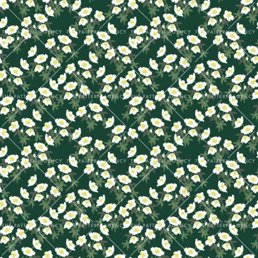 A seamless pattern with white Christmas rose flowers on a green background. The detailed flowers with their soft petals and yellow stamens create an elegant and sophisticated feel