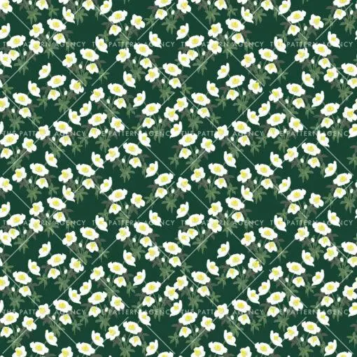 A seamless pattern with white Christmas rose flowers on a green background. The detailed flowers with their soft petals and yellow stamens create an elegant and sophisticated feel